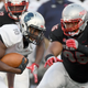 Jason Collins, No. 10 of the Howard Bison, runs against defensive lineman Jason Fao, No. 95 of the UNLV Rebels, during their game at Sam Boyd Stadium on Sept. 2, 2017, in Las Vegas. (Ethan Miller/Getty Images)
